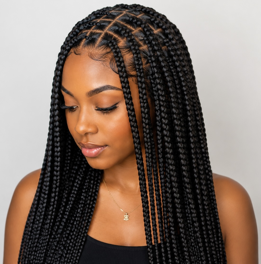 Long braided hairstyle by Kemlina Elite Braids